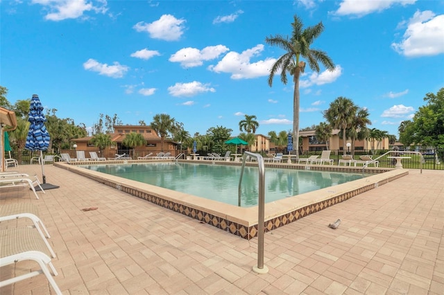 view of swimming pool with a patio