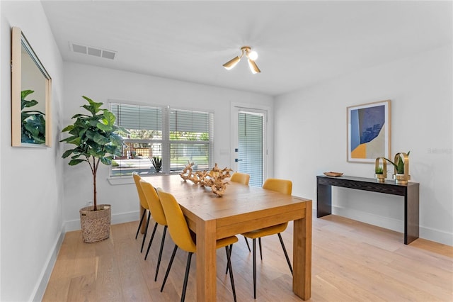 dining space featuring light wood-type flooring