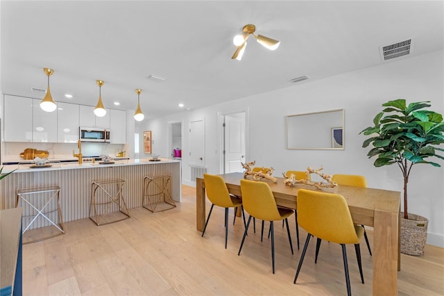 dining space featuring light hardwood / wood-style flooring