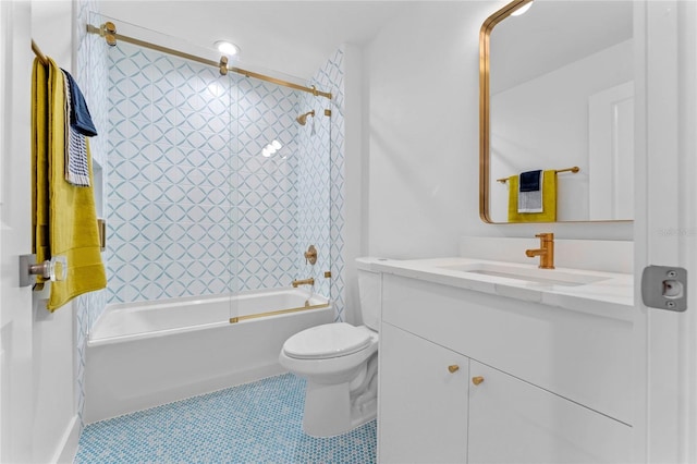 full bathroom with tile patterned floors, toilet, vanity, and tiled shower / bath