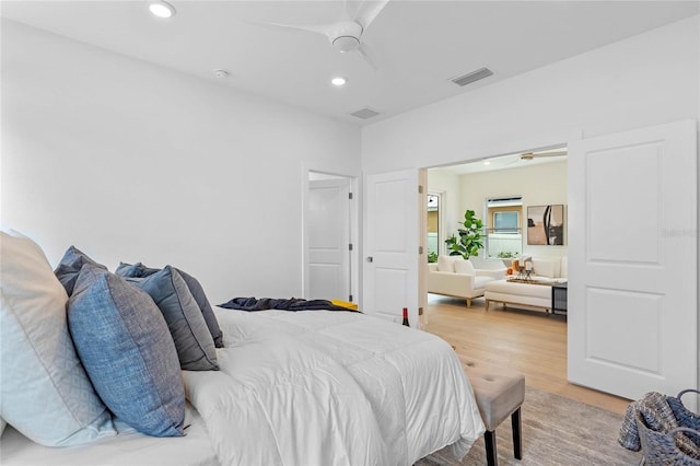 bedroom featuring hardwood / wood-style flooring and ceiling fan