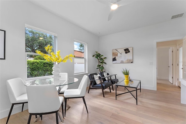 dining space featuring ceiling fan and light hardwood / wood-style flooring