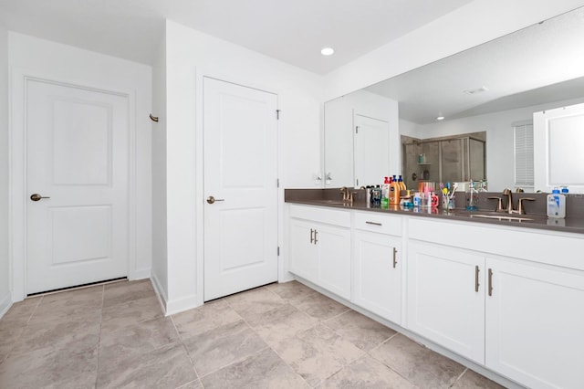 bathroom with vanity and walk in shower