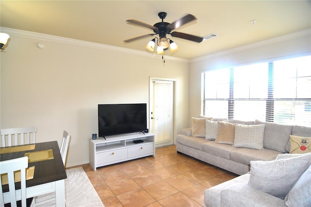 living room featuring ceiling fan, crown molding, and light tile patterned flooring