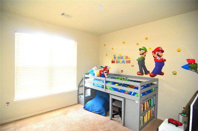 carpeted bedroom featuring multiple windows