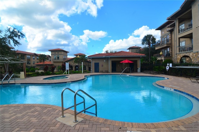 view of pool with a gazebo, a hot tub, and a patio area