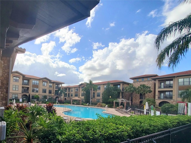 view of swimming pool with a patio