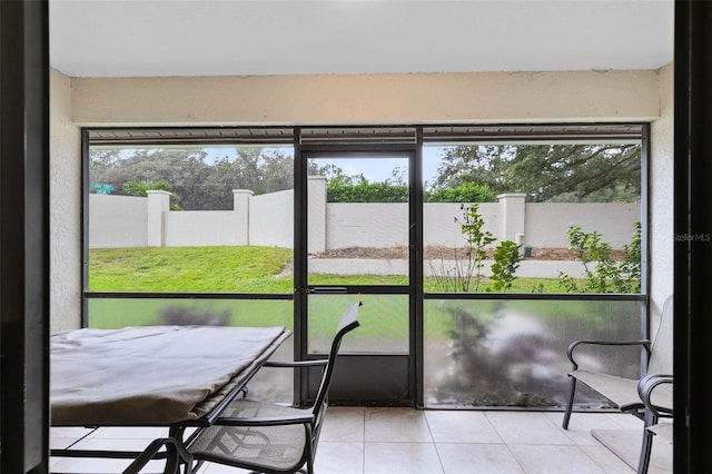 unfurnished sunroom with a healthy amount of sunlight