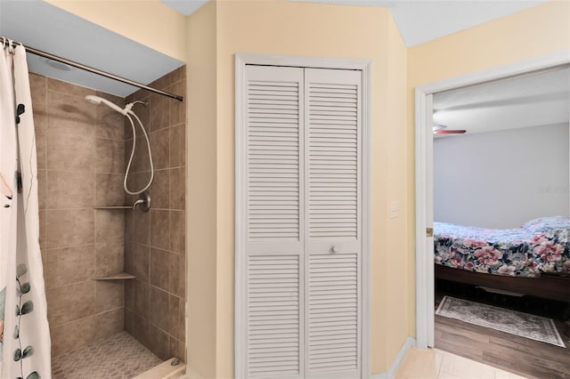 bathroom featuring hardwood / wood-style flooring and curtained shower