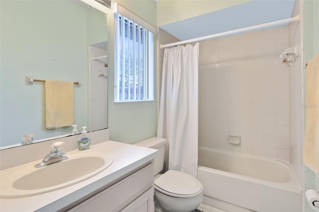 full bathroom with shower / tub combo with curtain, vanity, and toilet