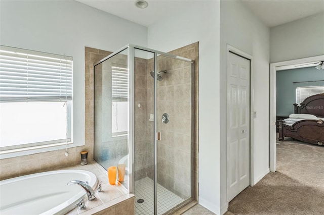 bathroom with shower with separate bathtub