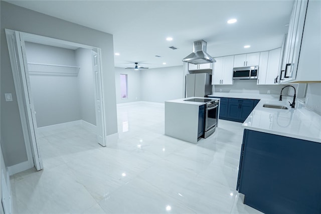 kitchen featuring stainless steel appliances, sink, ceiling fan, ventilation hood, and white cabinetry