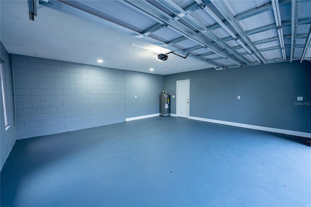 garage featuring water heater and a garage door opener