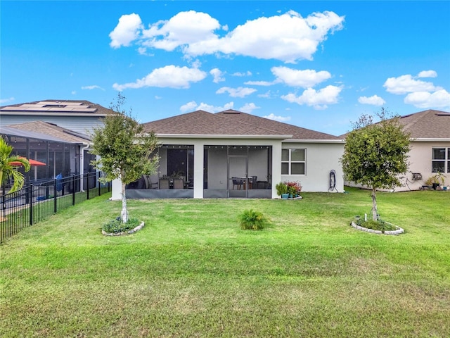 3286 Hanging Tide St, Winter Garden, FL 34787 - rear view of house with a sunroom, stucco siding, and roof with shingles