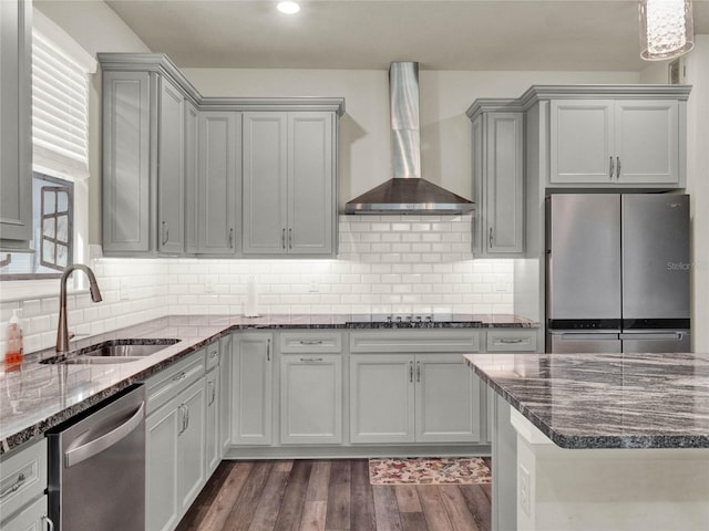 3286 Hanging Tide St, Winter Garden, FL 34787 - kitchen featuring appliances with stainless steel finishes, wall chimney exhaust hood, a sink, and gray cabinets