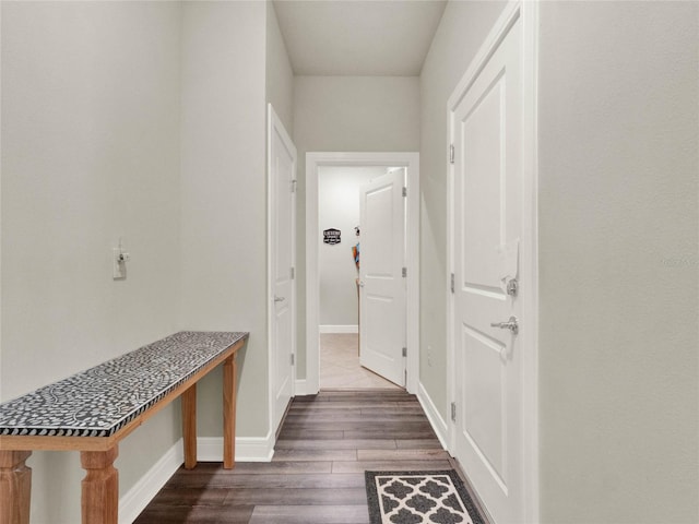 hall with dark hardwood / wood-style flooring