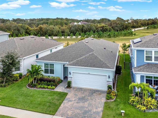 3286 Hanging Tide St, Winter Garden, FL 34787 - view of front of house with a garage, decorative driveway, roof with shingles, and stucco siding