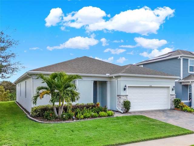 3286 Hanging Tide St, Winter Garden, FL 34787 - view of front of property featuring stucco siding, an attached garage, driveway, a front yard, and roof with shingles
