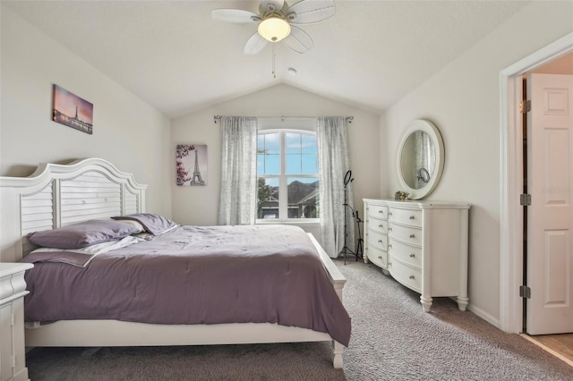 bedroom featuring ceiling fan, vaulted ceiling, and carpet floors