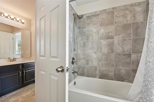 bathroom with shower / bath combo, vanity, and tile patterned floors