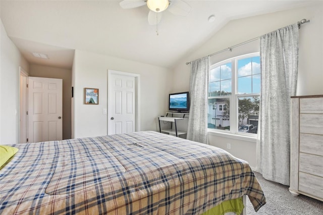 carpeted bedroom with lofted ceiling and ceiling fan