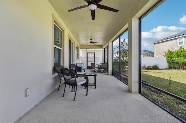 sunroom / solarium with ceiling fan