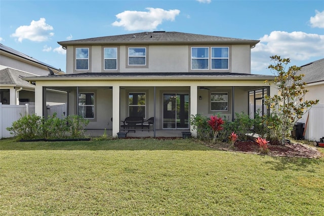 back of property with a porch and a yard