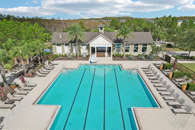 view of swimming pool with a patio area