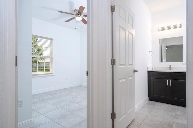 bathroom with vanity, ceiling fan, and tile patterned flooring