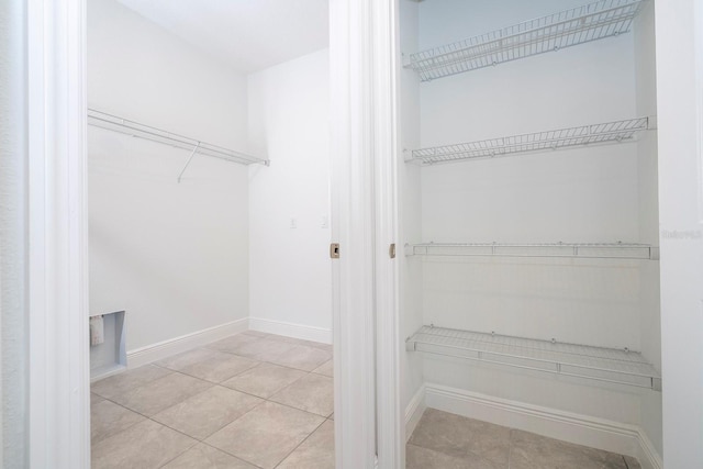 laundry room with light tile patterned floors