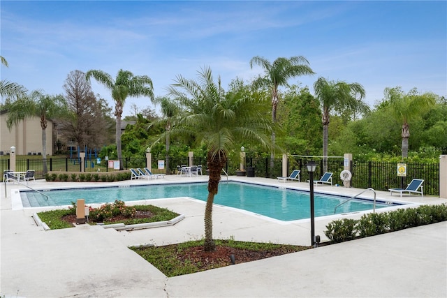 view of swimming pool with a patio