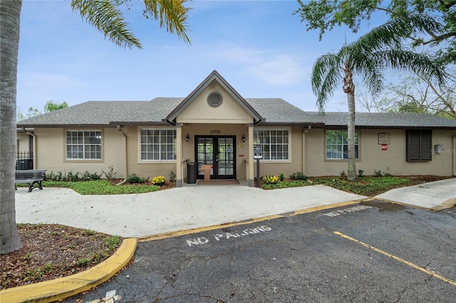 single story home featuring french doors