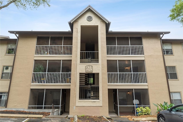 623 Dory Ln Unit 308, Altamonte Springs, FL 32714 - view of building exterior featuring uncovered parking