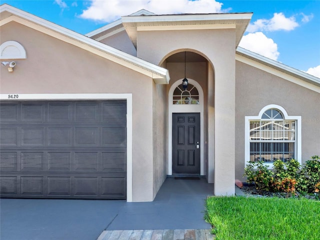 entrance to property featuring a garage