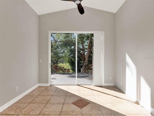 unfurnished room featuring light tile patterned floors, ceiling fan, and vaulted ceiling