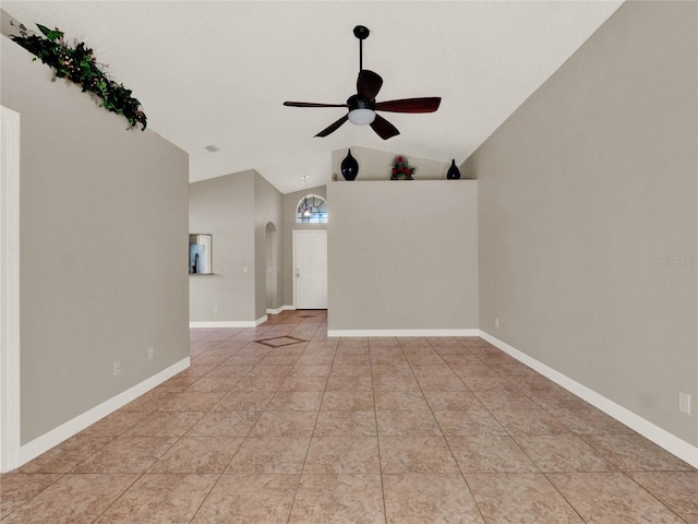 unfurnished room with light tile patterned flooring, ceiling fan, and vaulted ceiling