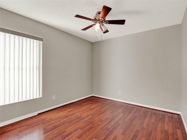 unfurnished room with a textured ceiling, hardwood / wood-style flooring, and ceiling fan