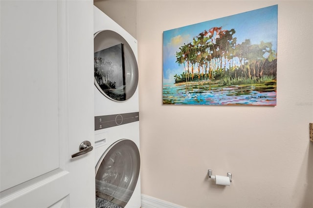 laundry room with stacked washer / drying machine