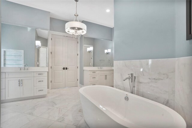 bathroom with a bath and vanity