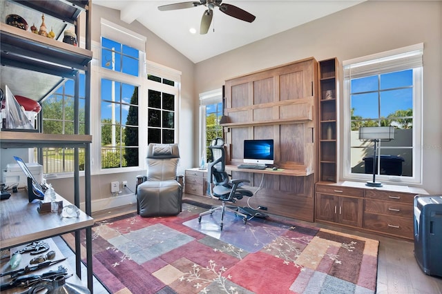 office space featuring lofted ceiling with beams, ceiling fan, and dark wood-type flooring