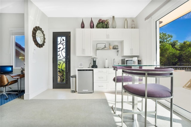 kitchen featuring white cabinetry and appliances with stainless steel finishes