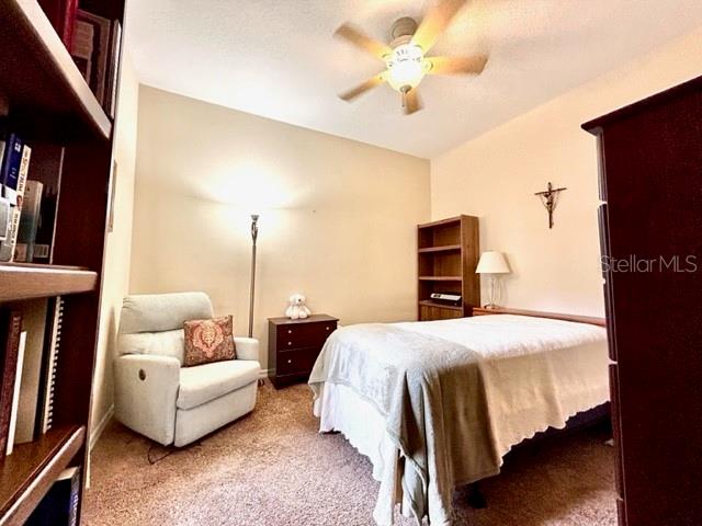 bedroom with carpet and ceiling fan