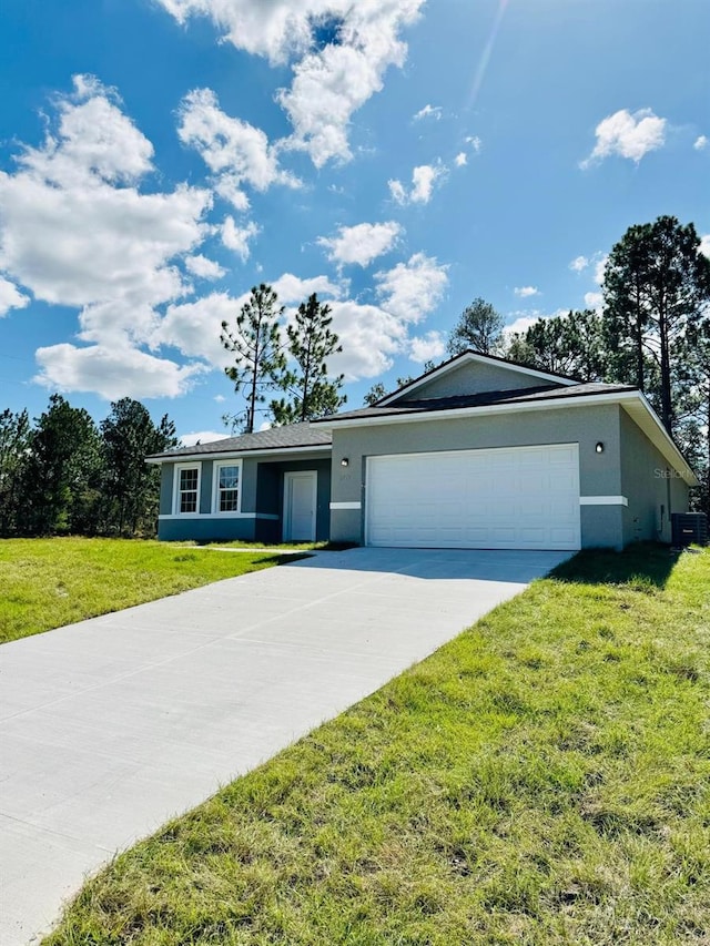 ranch-style home featuring a garage, cooling unit, and a front lawn