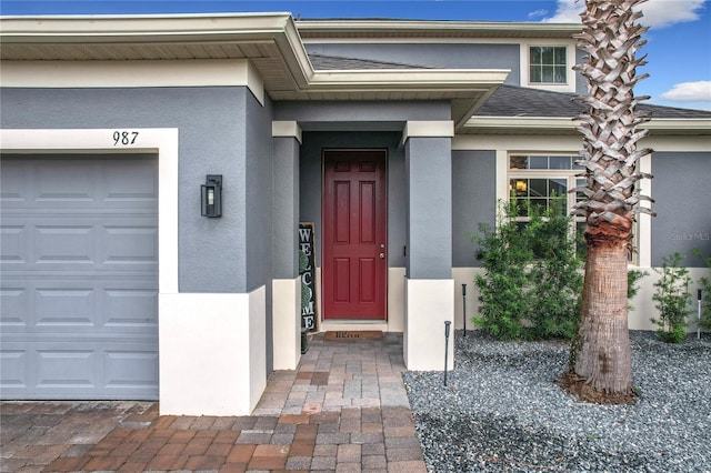 987 Nathan Ridge Rd, Clermont, FL 34715 - property entrance featuring stucco siding and an attached garage