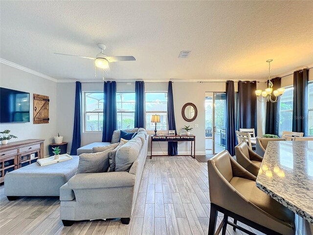 987 Nathan Ridge Rd, Clermont, FL 34715 - living area featuring a chandelier, a textured ceiling, crown molding, light wood finished floors, and ceiling fan