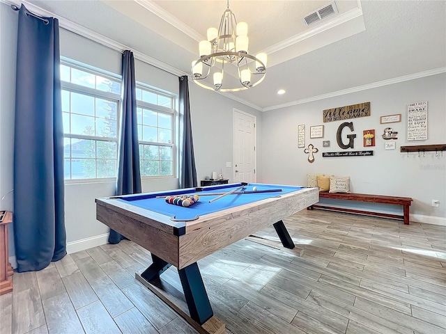 game room with ornamental molding, pool table, a notable chandelier, and light hardwood / wood-style floors