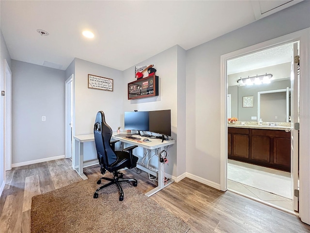 home office featuring light hardwood / wood-style floors