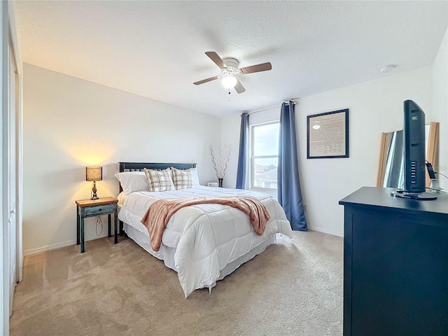 987 Nathan Ridge Rd, Clermont, FL 34715 - bedroom featuring light carpet, baseboards, and a ceiling fan