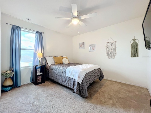 bedroom with light colored carpet and ceiling fan