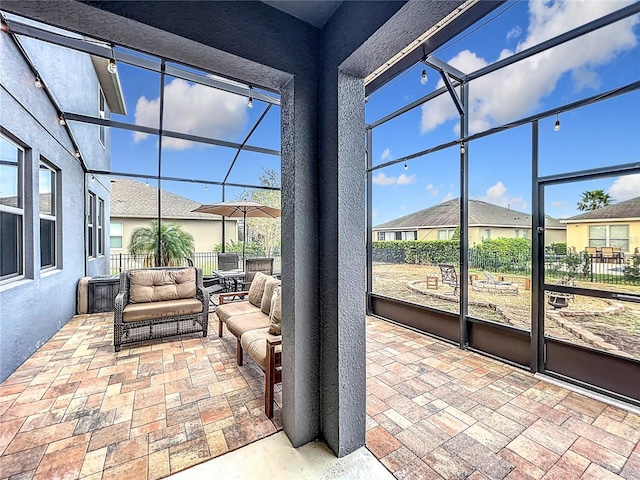 sunroom featuring plenty of natural light